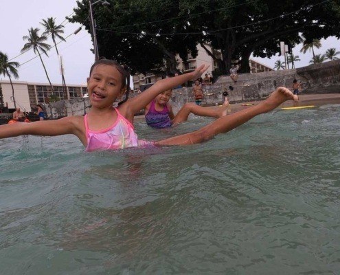 kids doing salty yoga in water