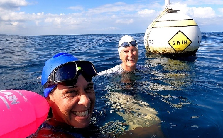 Kelly and Coach swim to the king's buoy